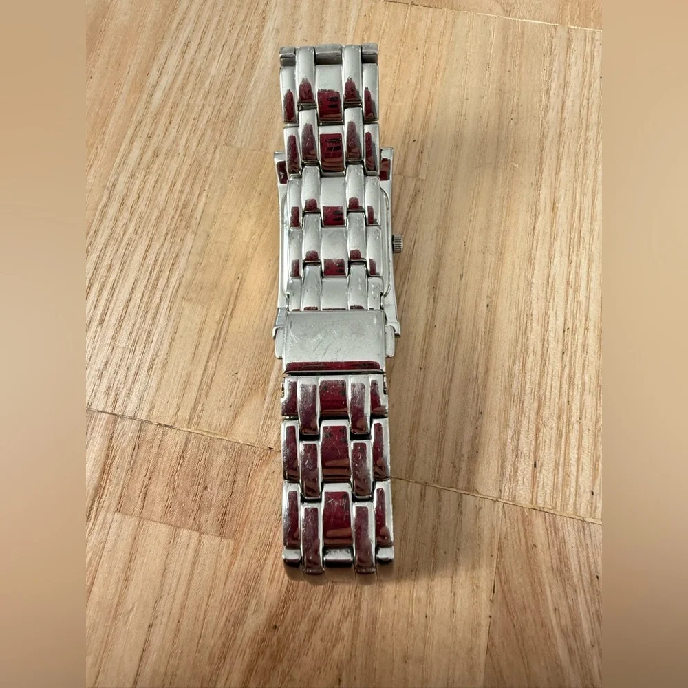 Kenneth Cole reaction ladies rectangular silver tone watch NEW BATTERY